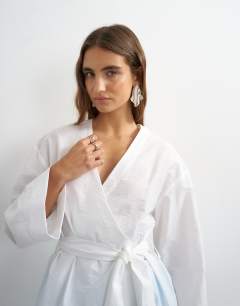 Model wearing Wrap tie detail top in white