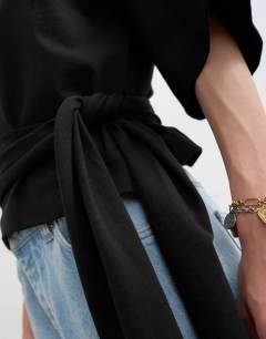 Model wearing Wrap waist tie detail top in black
