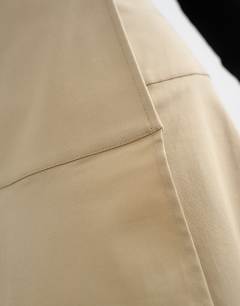 Model wearing Wrap waistband detail trench skirt in stone
