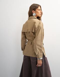 Model wearing X Cara denim cropped trench jacket in washed beige