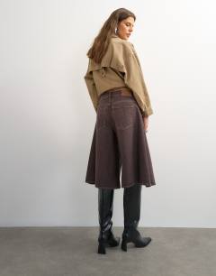 Model wearing X Cara denim ultra-wide pleated culotte in taupe
