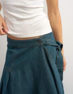 Model wearing X Cara denim waterfall drape pleated skirt in green cast