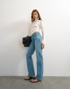 Model wearing X Cara high rise slim straight jean in green cast