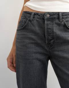 Model wearing X Cara high rise slim straight jean in washed black