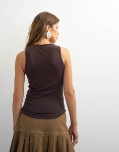 Model wearing X Cara scoop neck semi sheer tank top in brown