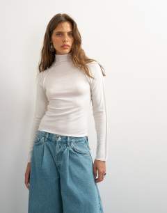 Model wearing X Cara seamed long sleeve T-shirt in ecru