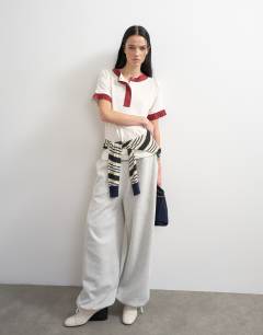 Model wearing Topshop x Talia Byre contrast trim jersey top in off white
