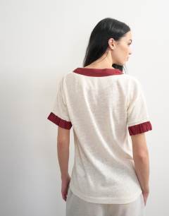 Model wearing Topshop x Talia Byre contrast trim jersey top in off white