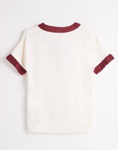 Model wearing Topshop x Talia Byre contrast trim jersey top in off white