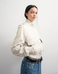 Model wearing Topshop x Talia Byre leather jacket in off white