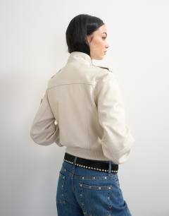 Model wearing Topshop x Talia Byre leather jacket in off white