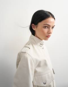 Model wearing Topshop x Talia Byre leather jacket in off white