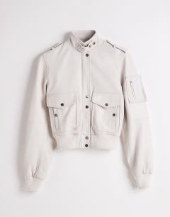 Model wearing Topshop x Talia Byre leather jacket in off white
