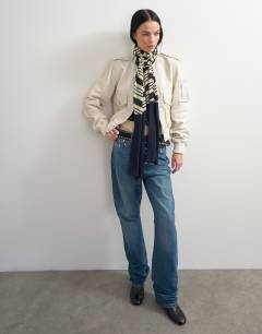 Model wearing Topshop x Talia Byre merino wool scarf in white stripe