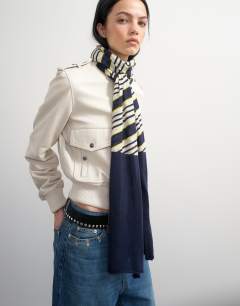 Model wearing Topshop x Talia Byre merino wool scarf in white stripe