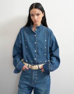 Model wearing Topshop x Talia Byre premium hair on real leather studded belt in ecru with burgundy backing