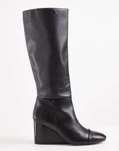 Model wearing Topshop x Talia Byre premium real leather knee high boot in black