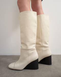 Model wearing Topshop x Talia Byre premium real leather knee high boot in off white