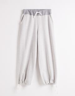 Model wearing Topshop x Talia Byre pull cord hem joggers in grey