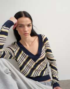 Model wearing Topshop x Talia Byre semi sheer merino wool v neck jumper in ecru stripe