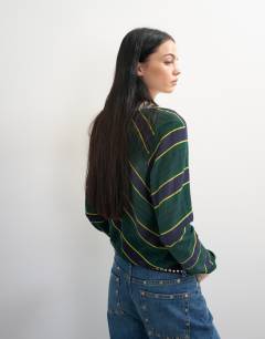 Model wearing Topshop x Talia Byre semi sheer merino wool v neck jumper in green stripe