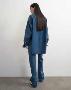 Model wearing Topshop x Talia Byre wide placket studded shirt in washed blue
