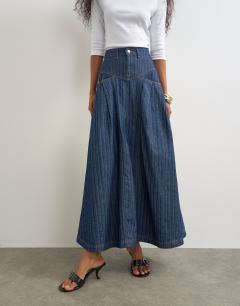 Model wearing Yoke pleated maxi skirt in indigo stripe