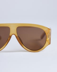 Model wearing Zante aviator sunglasses in milky orange