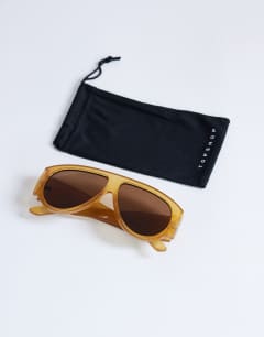 Model wearing Zante aviator sunglasses in milky orange