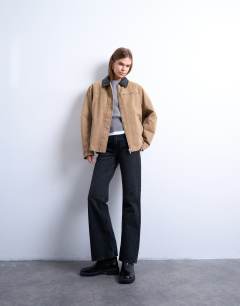 Model wearing Zip through barn jacket with contrast PU collar in tan - TAN