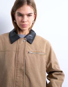 Model wearing Zip through barn jacket with contrast PU collar in tan - TAN