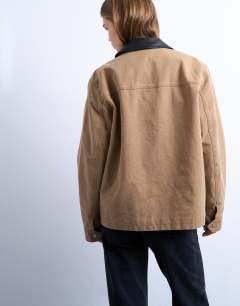 Model wearing Zip through barn jacket with contrast PU collar in tan - TAN