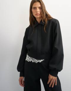 Model wearing Zip through formal blazer in black