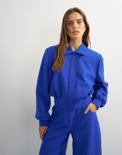 Model wearing Zip through formal blazer in blue