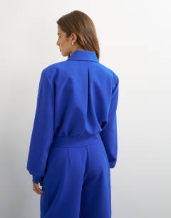 Model wearing Zip through formal blazer in blue