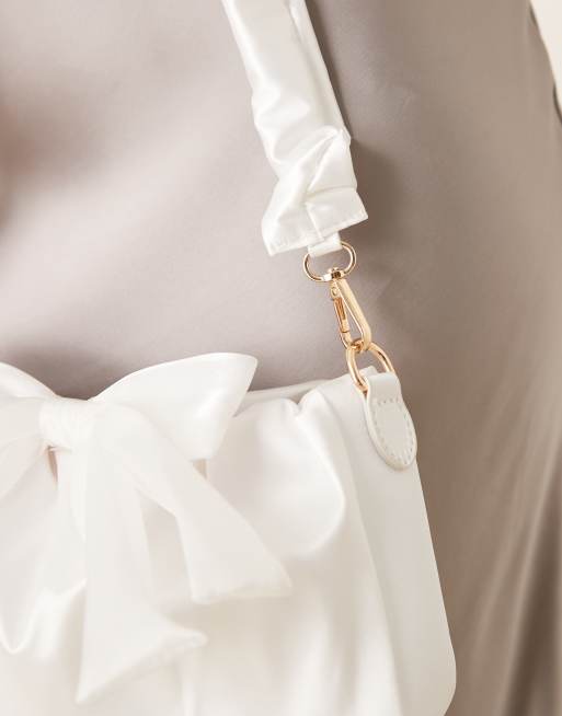 True Decadence bow detail shoulder bag in white, 2 of 4