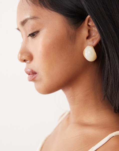 True Decadence chunky resin faux pearl stud earrings in gold tone - view 1