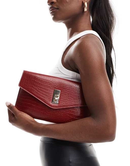 True Decadence classic clutch bag in burgundy ASOS