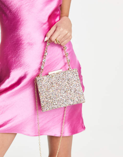 True Decadence clutch bag in pink glitter with chunky chain grab handle