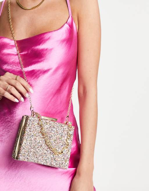 True Decadence clutch bag in pink glitter with chunky chain grab handle