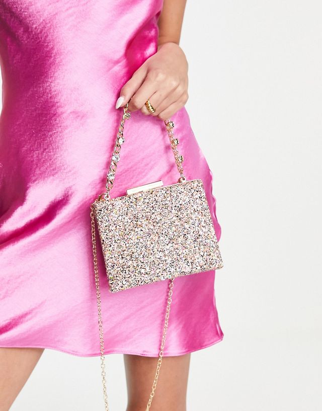 True Decadence clutch bag with chunky chain grab handle in pink glitter