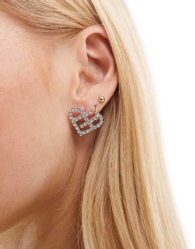 True Decadence - crystal cut out heart stud earrings in silver