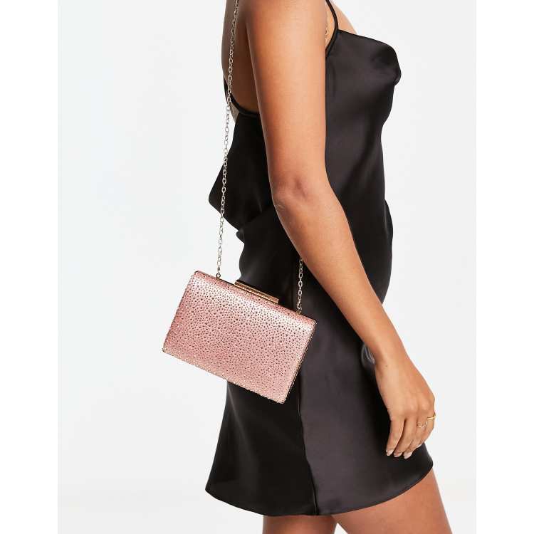 Pink and 2024 gold clutch bag