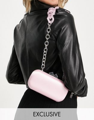 True Decadence Exclusive cross body bag in pink satin with resin chain strap