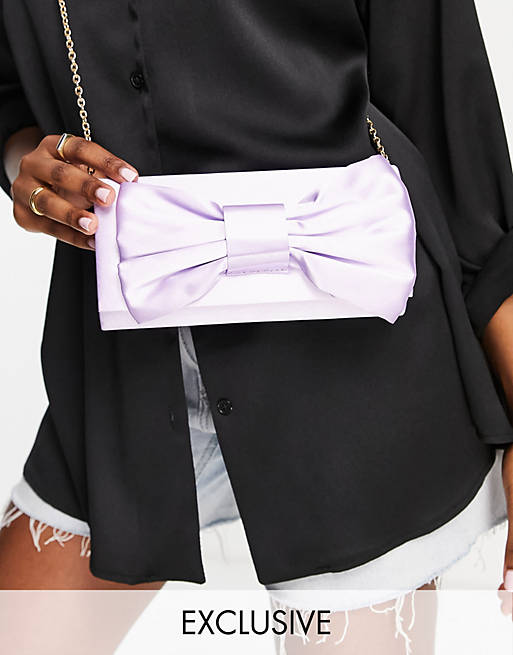 True Decadence Exclusive foldover clutch bag with bow detail in lilac