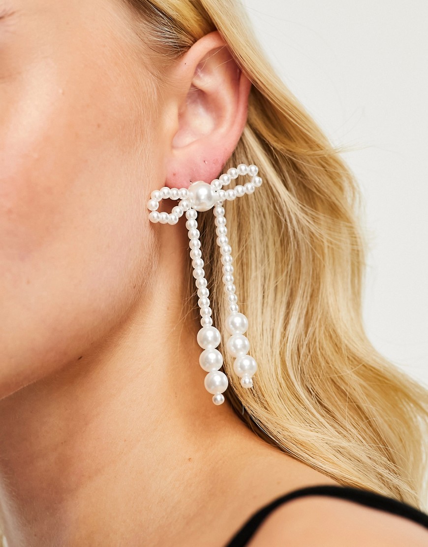 True Decadence faux pearl statement bow earrings in silver