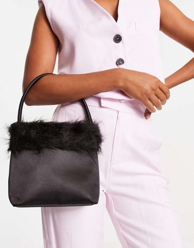 True Decadence handle grab bag in black satin with fluffy faux fur trim