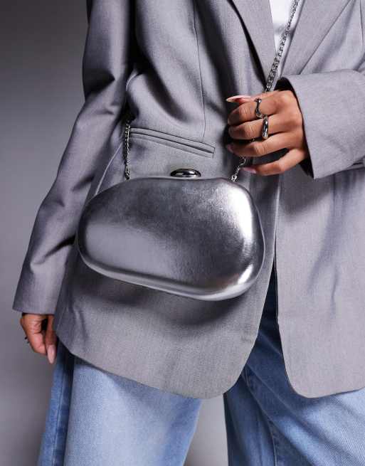 True Decadence hard molten clutch bag with detachable crossbody strap in silver