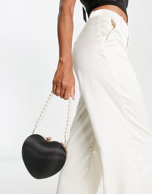 True Decadence heart clutch bag in black satin with faux pearl handle - ASOS Price Checker
