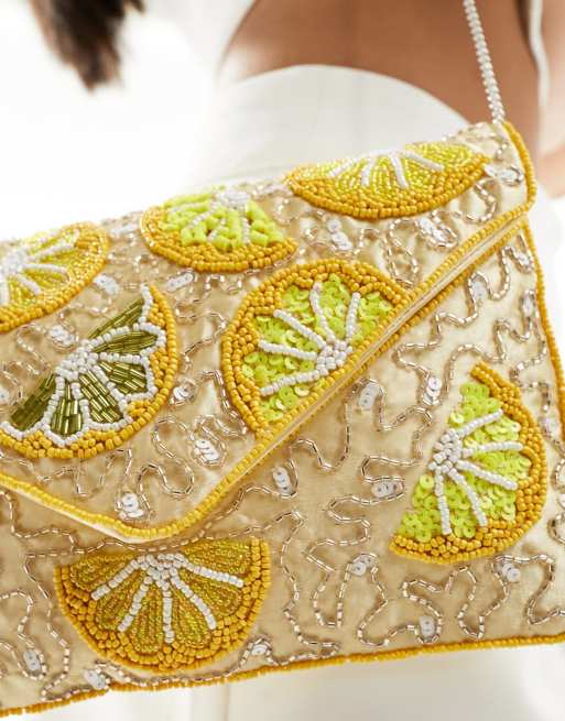 Pale lemon clutch bag deals